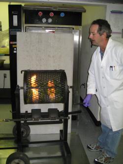 Image of Paul roasting New Mexico green chile in a roaster